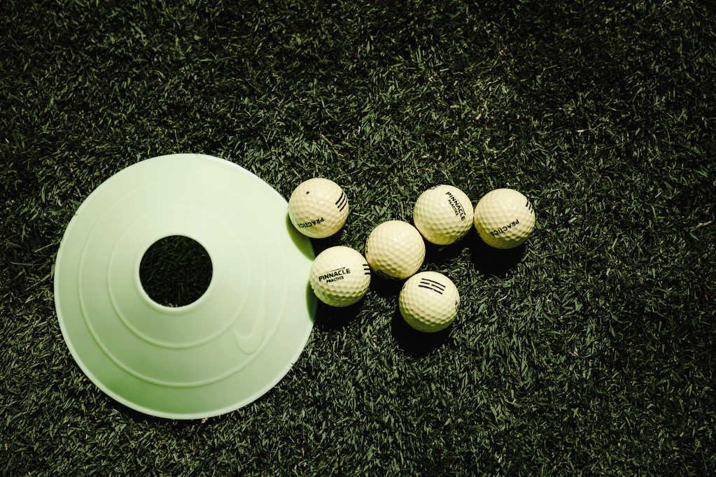 Golf balls near practice hole